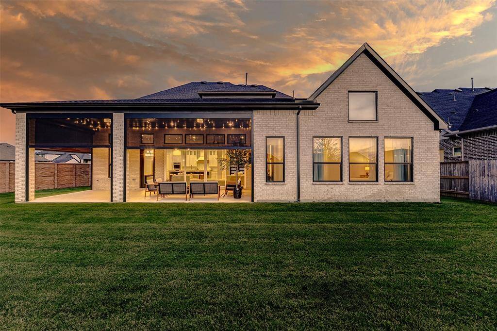 Step outside to your private oasis, where a spacious covered patio awaits—perfect for outdoor relaxation and entertaining. The lush green space and fully fenced backyard offer both privacy and plenty of room for outdoor activities.