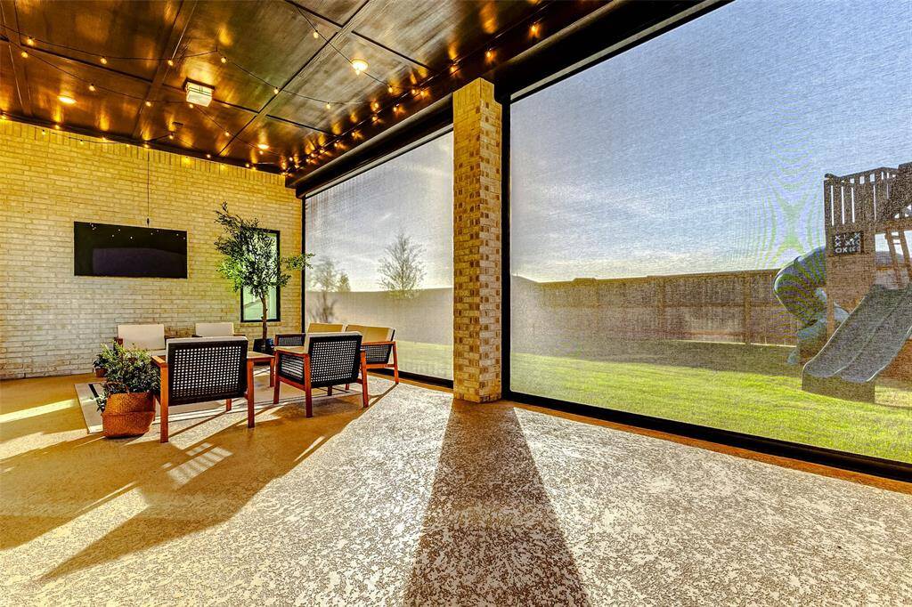 Just imagine relaxing here every day—on your extended covered patio, savoring the peaceful ambiance from the comfort of your outdoor retreat.