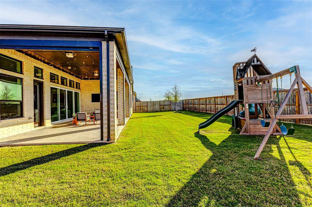 The home is fully equipped with gutters, a sprinkler system, and the backyard features French drains for efficient water management.