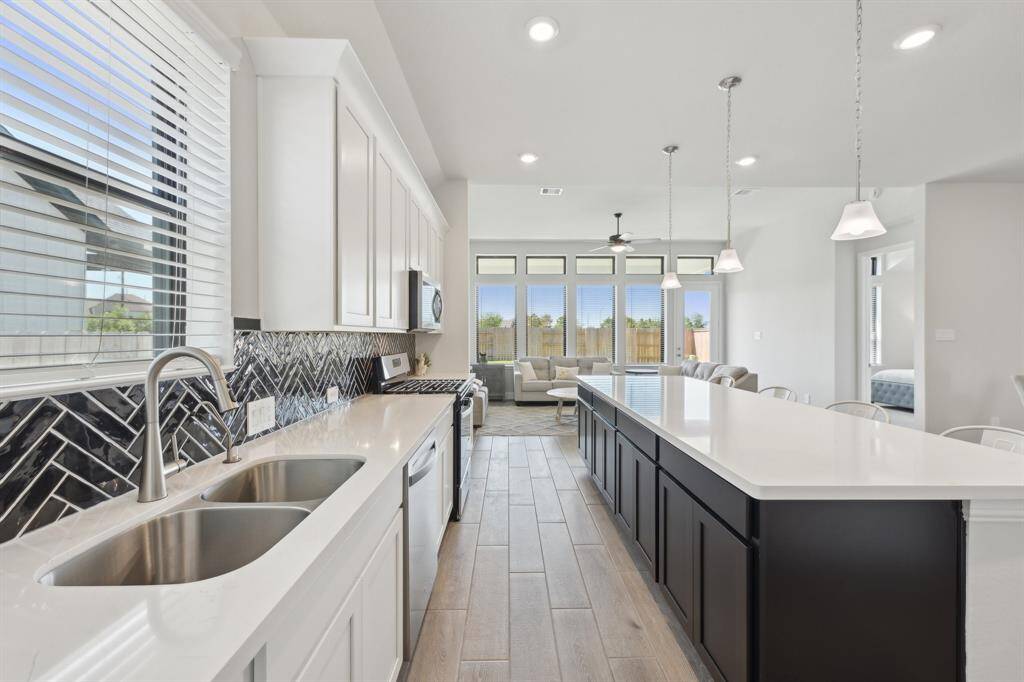 Double sinks, and quartz countertops.