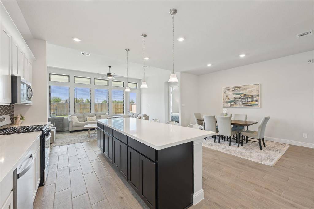 Bright open floor plan that flows from kitchento dining area to living room.