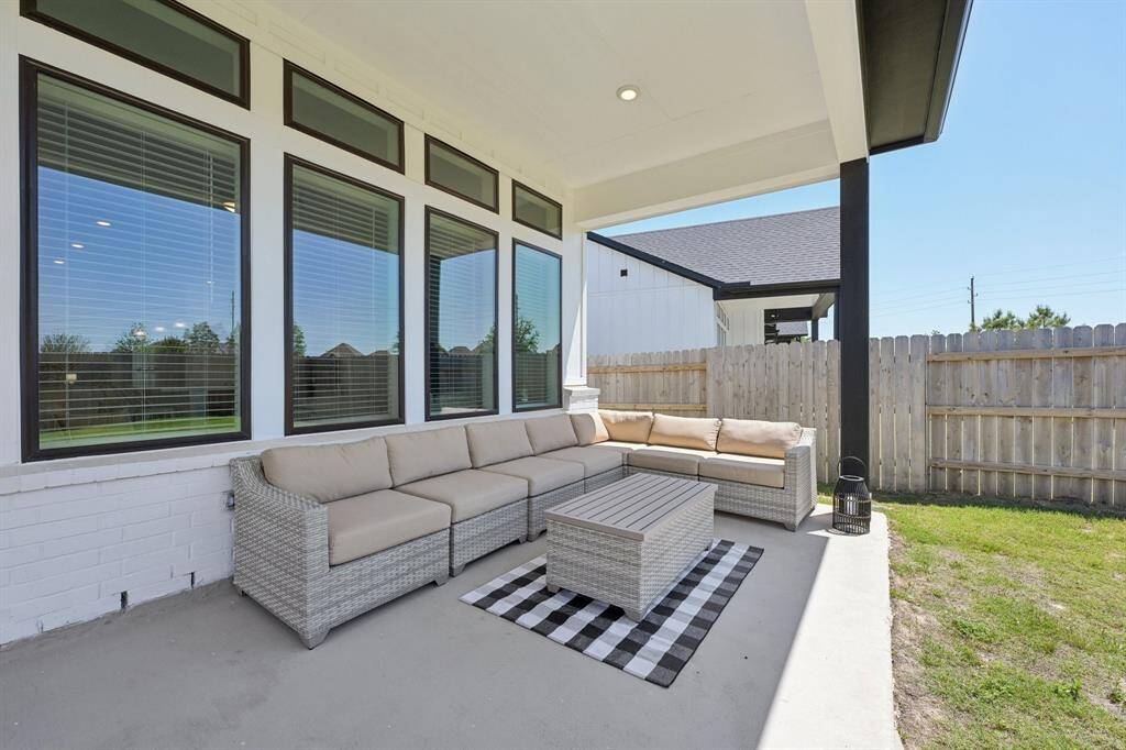 Large covered back patio is perfect for relaxing and entertaining.