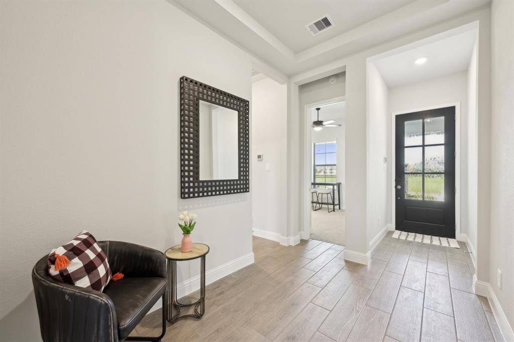 Entry way with one bedroom to the left, and one to the right.