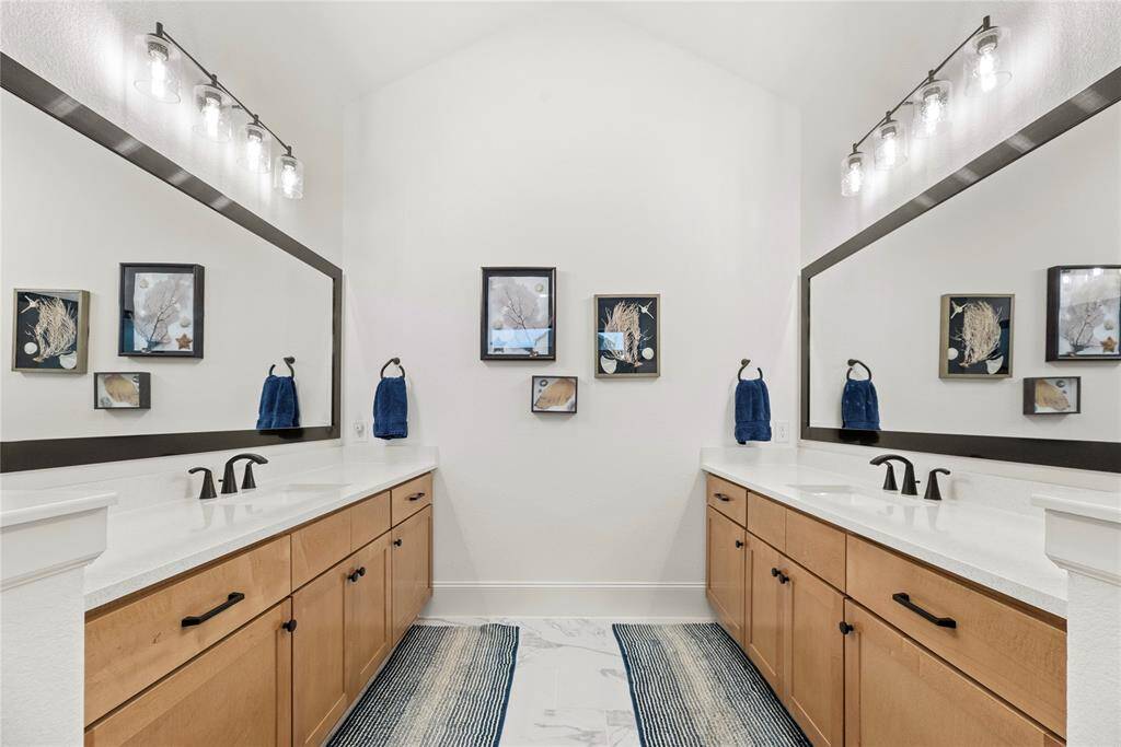 Dual vanities in your primary bath, offer personal space with tons of dedicated cabinet space.