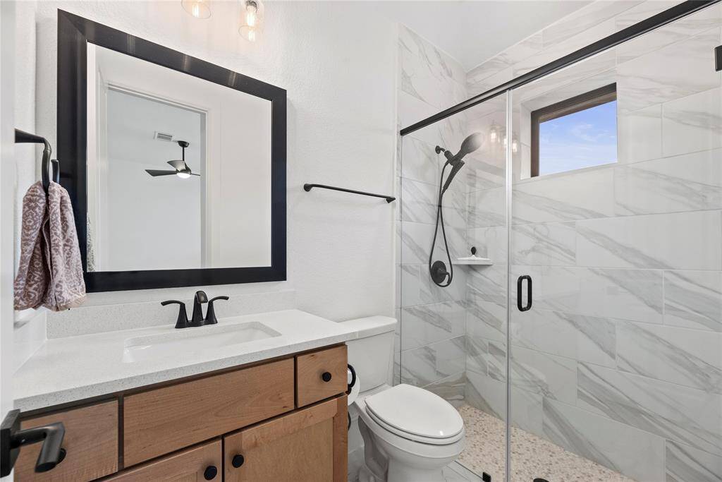 The dedicated private full bath for your 2nd bedroom with stylish walk-in shower.