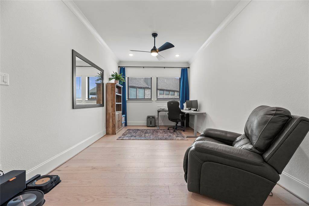 A private study to the left of the entry adds a touch of sophistication and privacy to the home. It suggests a space dedicated to concentration, creativity, and productivity.