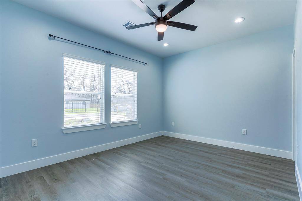 Primary Room with Plank Flooring and a lot natural lighting