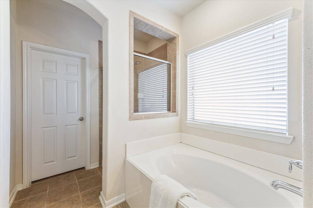 View of the soaking tub and shower in ensuite bathroom