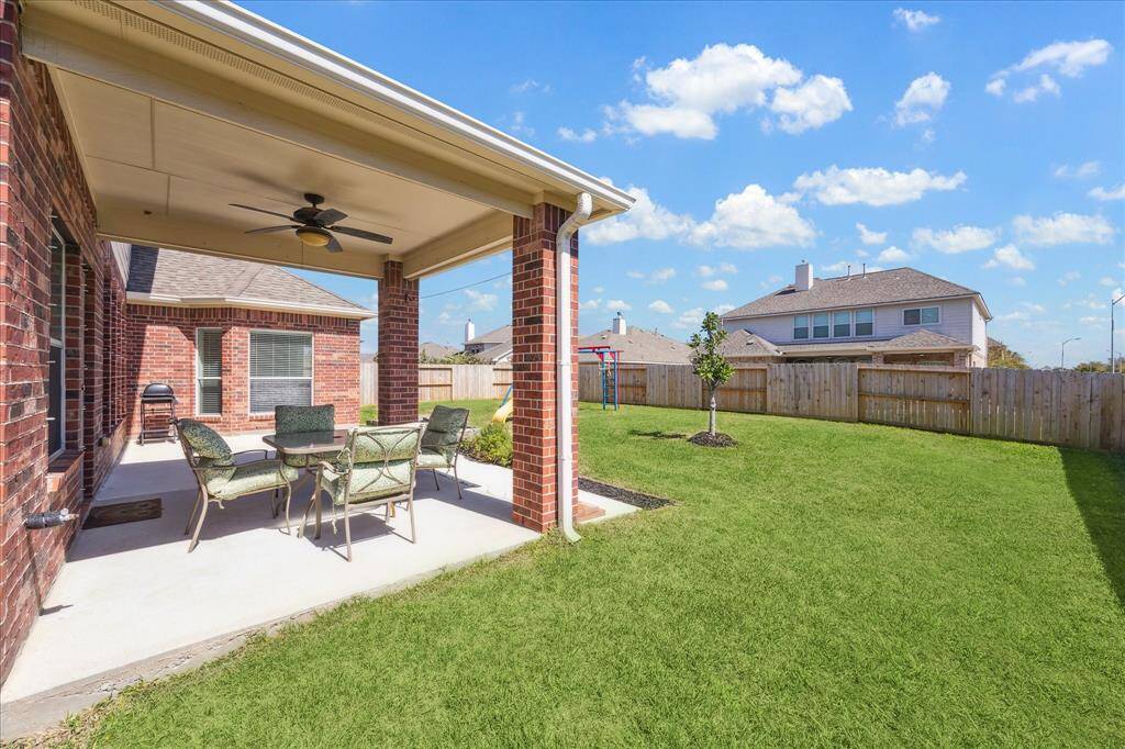 Another view of the patio area and back yard