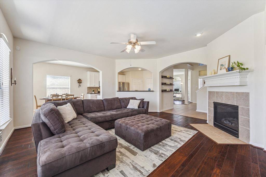 Another view of the family room w/ gas fireplace that looks into the kitchen area.