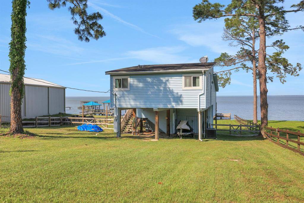 Front of home view. There is some parking room under the home along with a storage area
