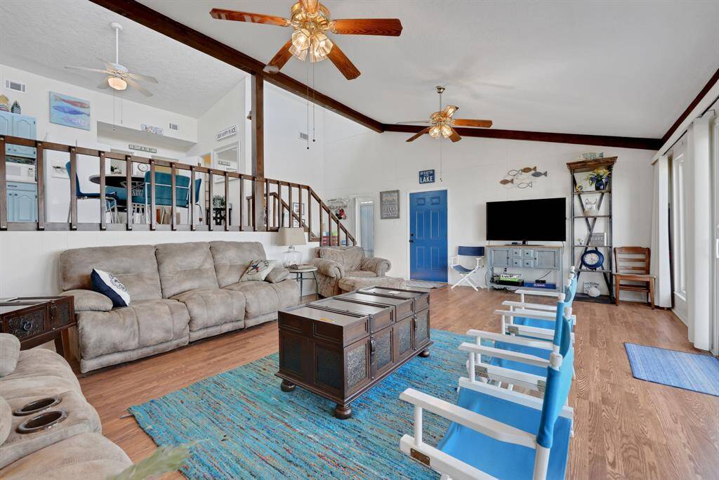 The living area has high ceilings and is open to the kitchen - great for entertaining or just hanging out!