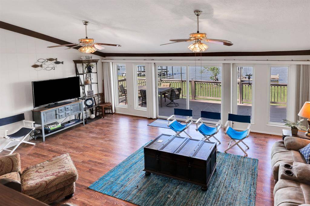 The floor to ceiling windows allow natural light to flood the room.