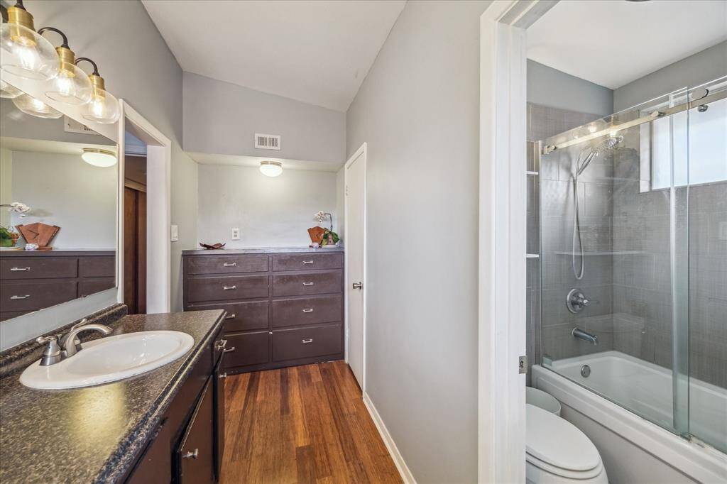 Separate tub/shower.  Additional built in drawers at the far end, the ceiling is also vaulted in this space.