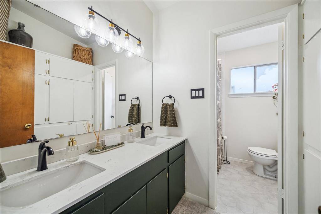 Nicely updated guest bath which also has double sinks.