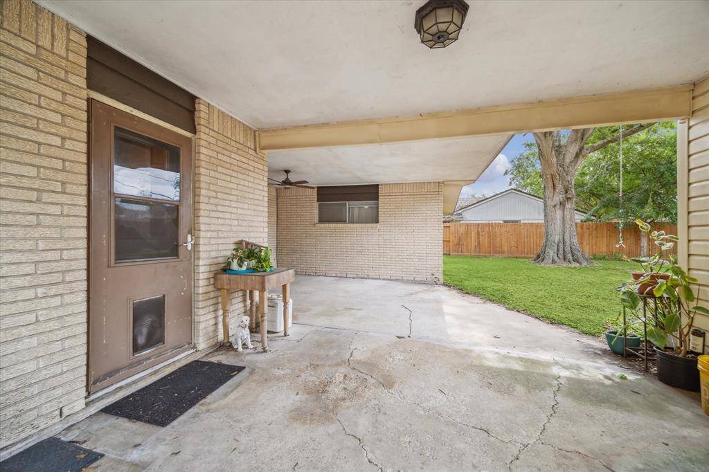 From the utility room door, there is a wide breezeway leading to the double car garage and covered patio.
