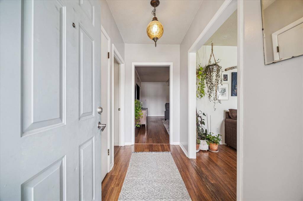 Foyer with engineered wood flooring. (no flipper gray floors!)