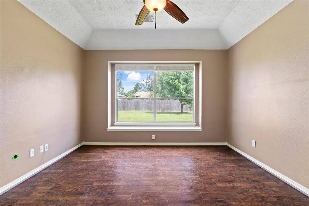 Retreat to a generously sized primary suite designed for comfort and relaxation. With soft natural light flowing from the large windows and LVP flooring to give you the durability for easy maintenance.