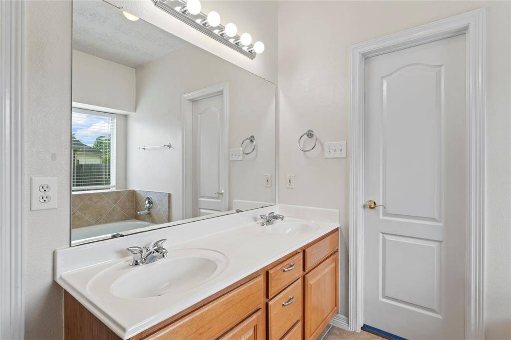 Enjoy the comfort of a well appointed his and hers double sinks, featuring cabinet space for storage and style.