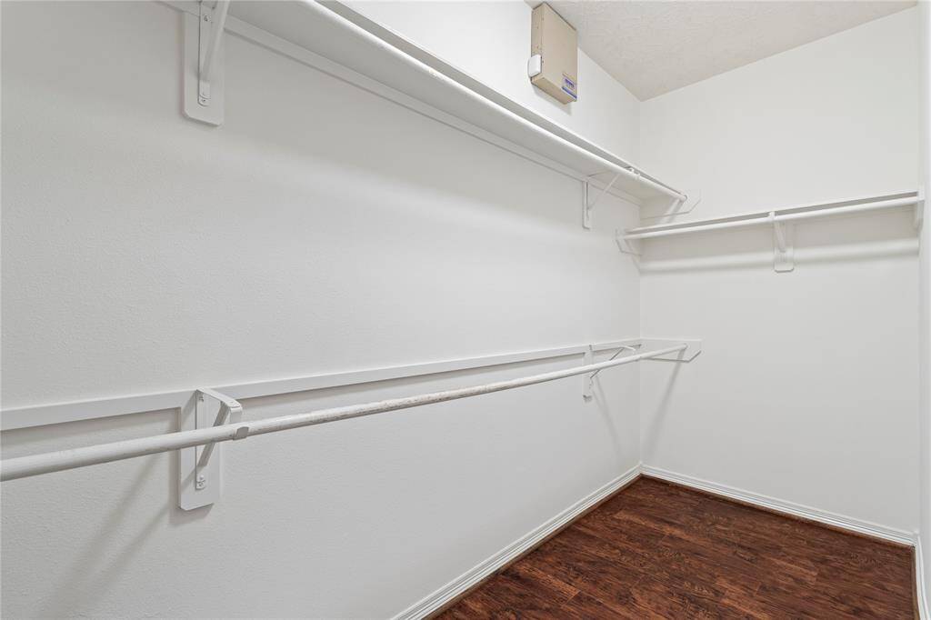 Direct access to a spacious walk-in closet, creating a seamless blend of elegance and practicality with LVP flooring all throughout.