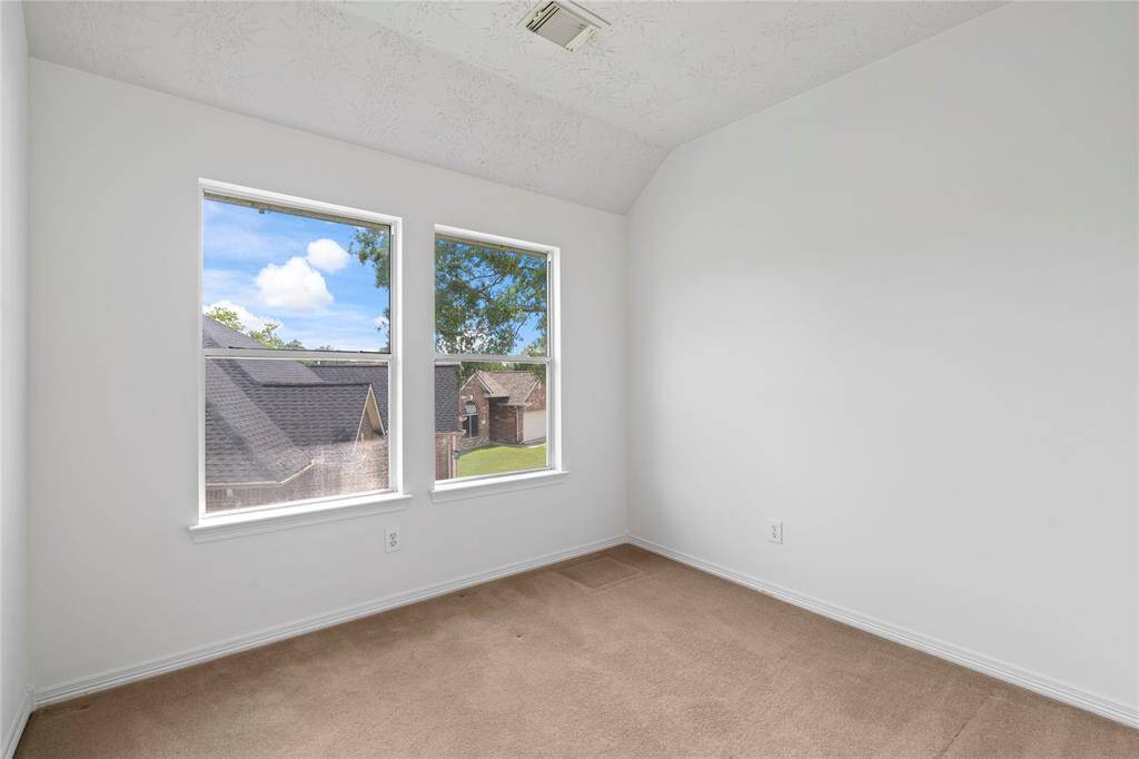 Located in the quiet upstairs area, this third bedroom is perfect for restful nights. It’s filled with natural light and offers ample closet space for all your needs.