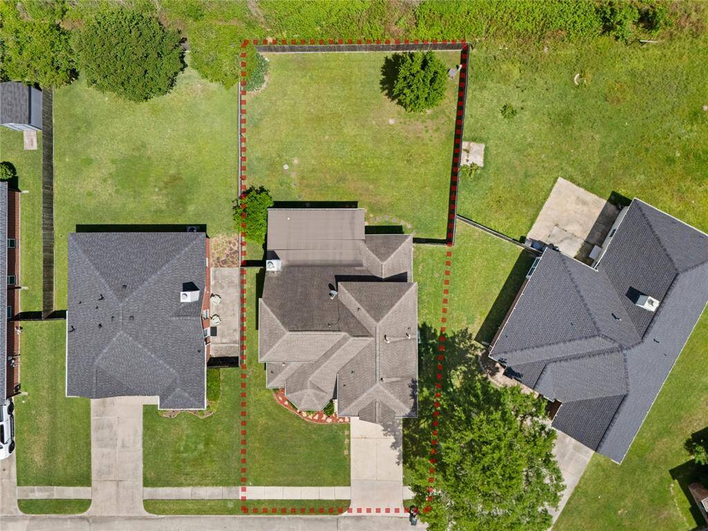 With an expansive lot and no back neighbors, the backyard offers the perfect setting for a private outdoor oasis. The covered back porch extends your living space outdoors, creating a peaceful spot to unwind or entertain.