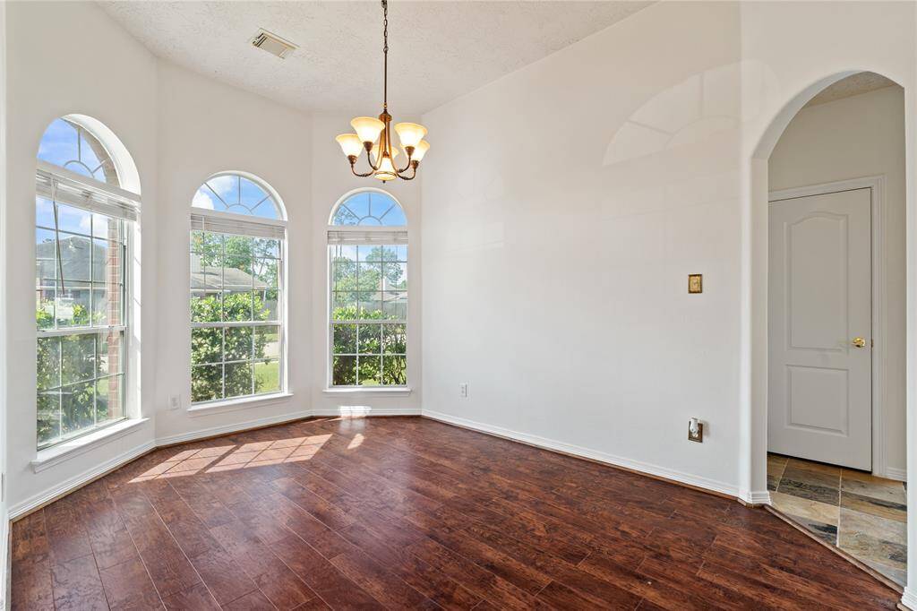 Enjoy a dedicated formal dining space that blends function and charm, conveniently located off the kitchen for easy flow while entertaining or enjoying quiet family dinners. Complete with large windows that fill the space with natural light.