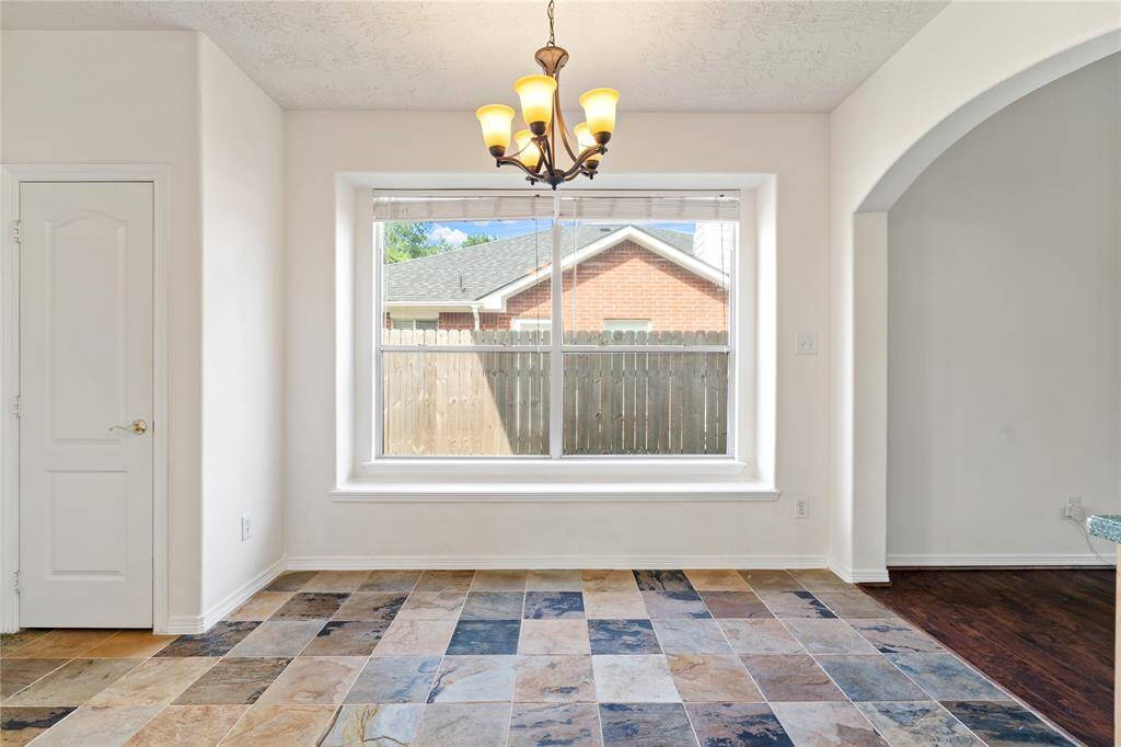 Start your day in the welcoming breakfast nook, surrounded by sunlit windows and just steps from the kitchen. It’s an ideal spot for everyday meals or weekend brunch with loved ones.