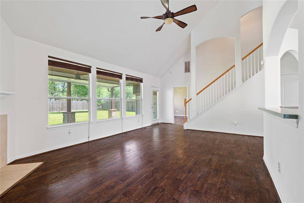 Step inside to a freshly painted interior that exudes a clean, modern feel. The main living area boasts rich LVP flooring adding character, while large windows bring in abundant natural light.