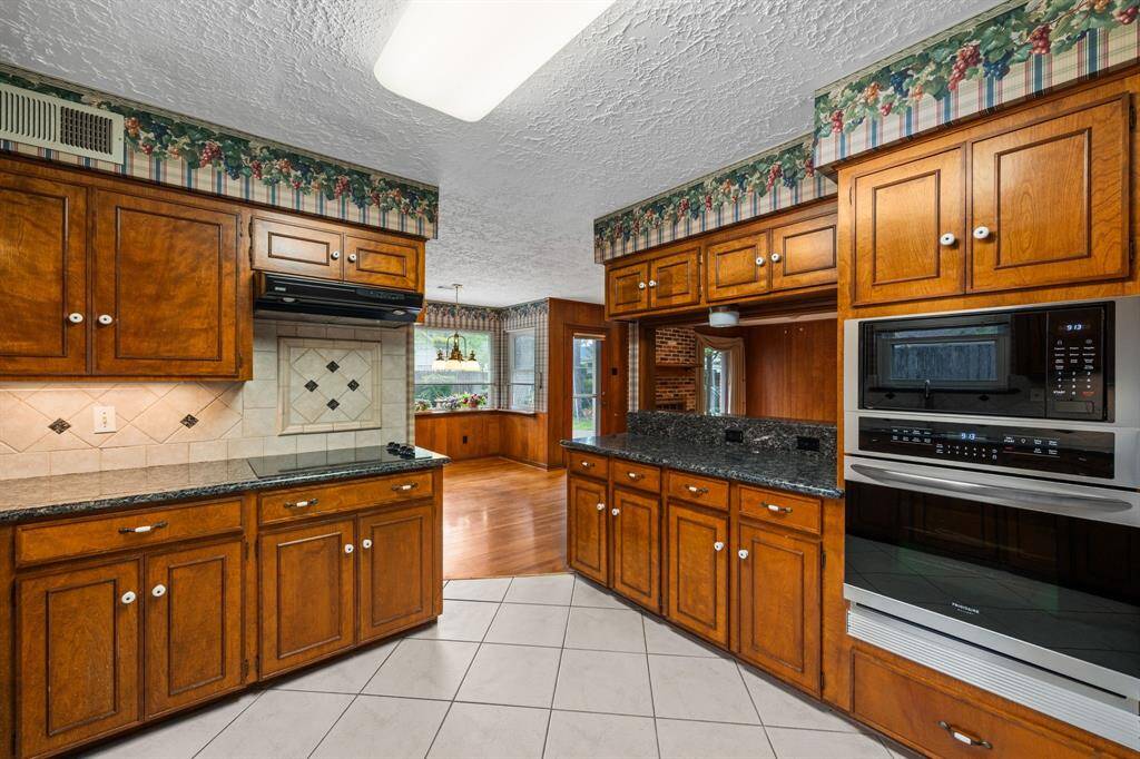 Kitchen view into breakfast room. Frigidaire oven and microwave replaced 2021.