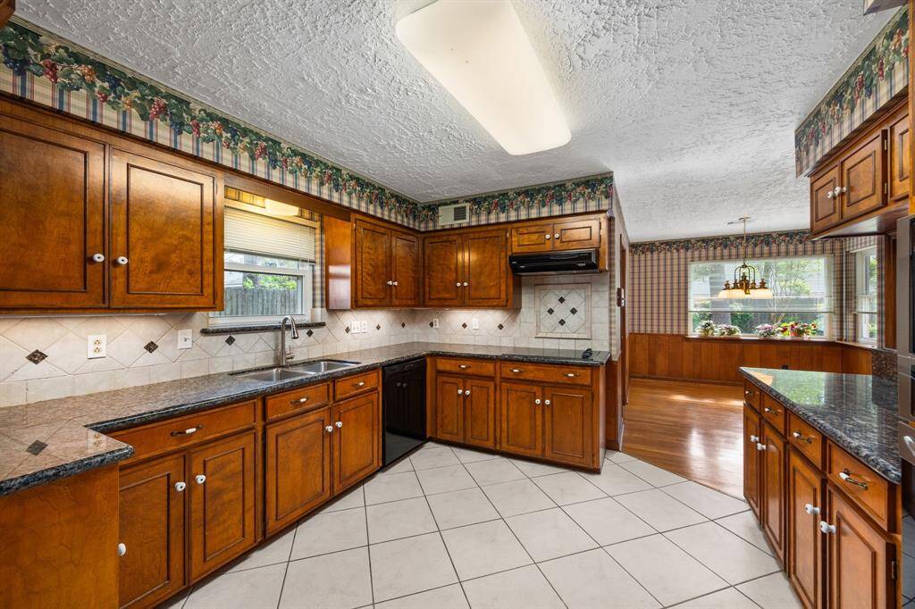 Kitchen showing tile floors (2021).