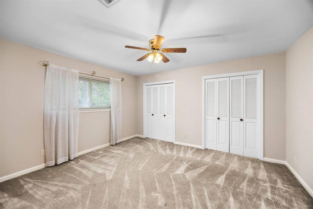 Secondary bedroom, carpeted with good closets