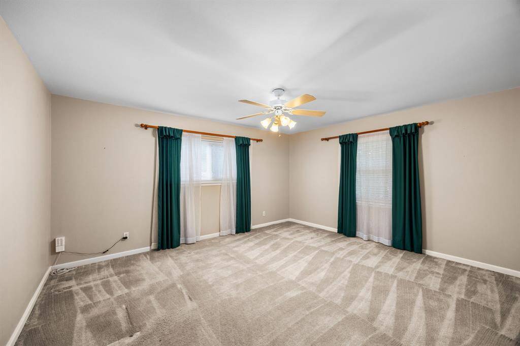 Carpeted secondary bedroom