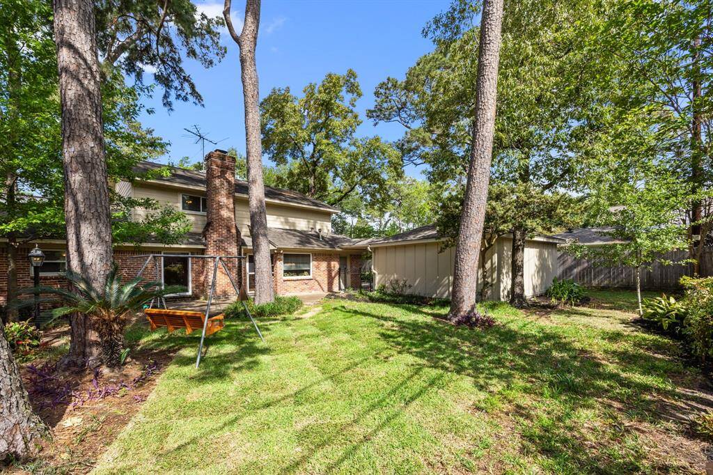 Large back yard to enjoy has mature trees