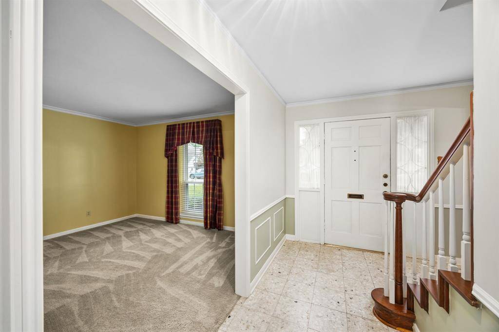 Living room is to left of entry