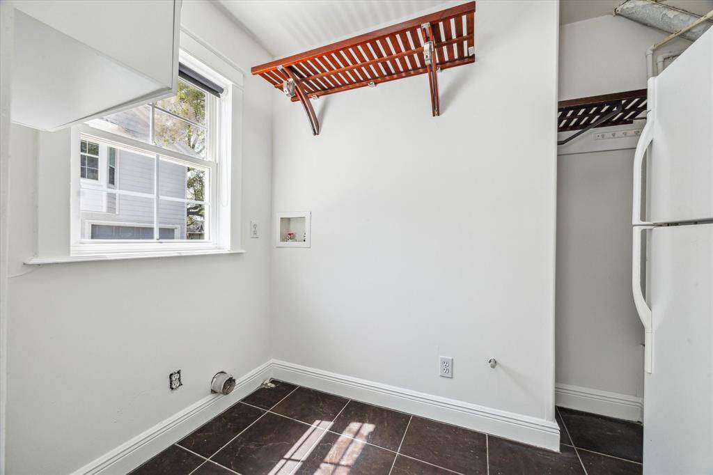 First floor utility room, large enough for an extra refrigerator which conveys with the house