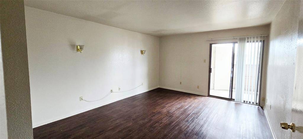 Primary bedroom with balcony access and wonderful views.