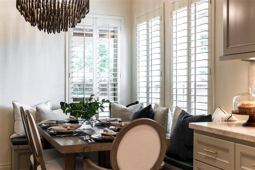 Family room.  Plantation shutters and custom cast fireplace and much more!