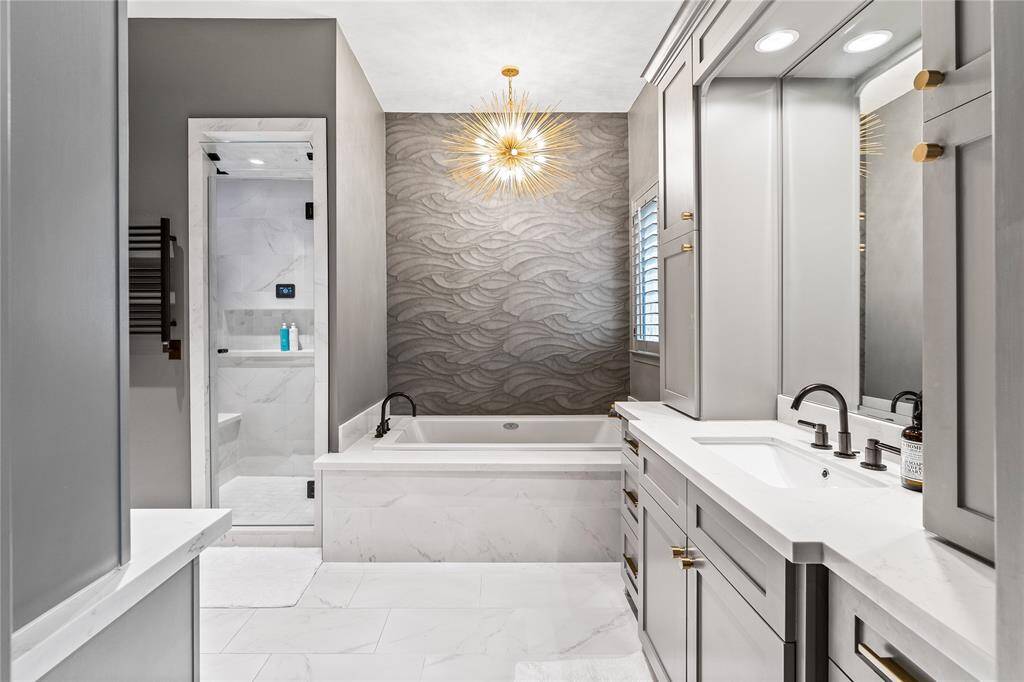 Half bath downstairs with beautiful, textured wallpaper and very private