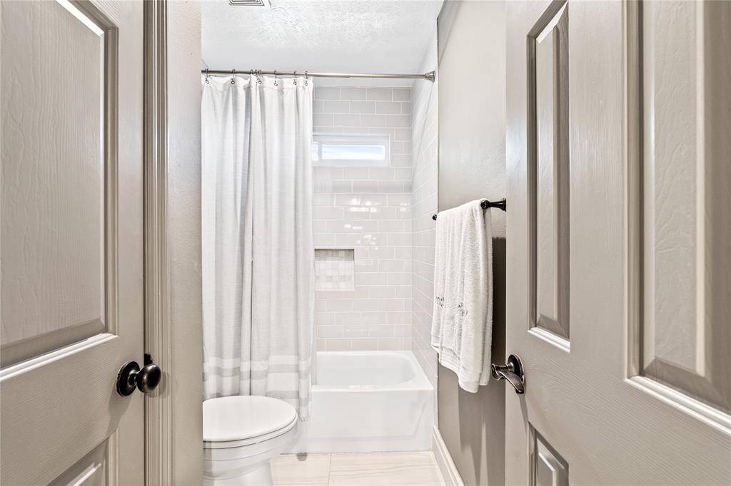 Bath area between his and her bedrooms