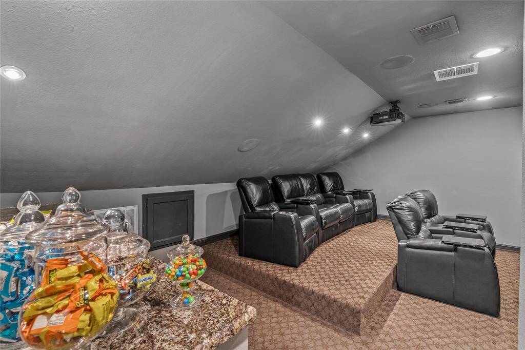 Media room.  110" screen with projector, theatre like sound, bar area with built-in refrigerator.