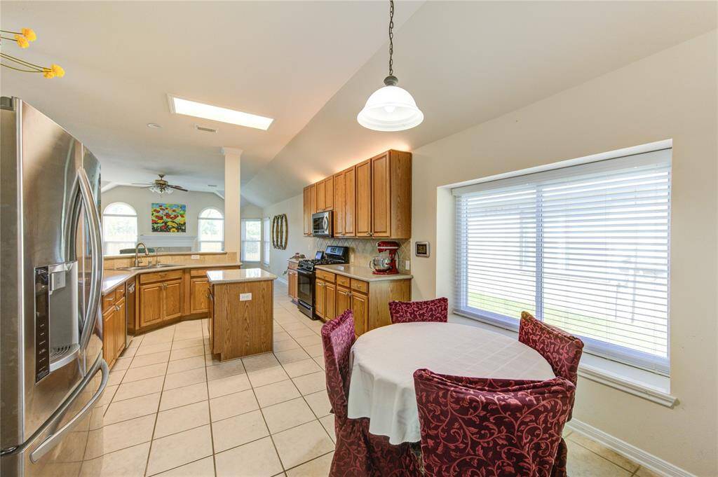 Enjoy casual meals in the spacious breakfast nook, where abundant natural light creates a warm and cheerful atmosphere.