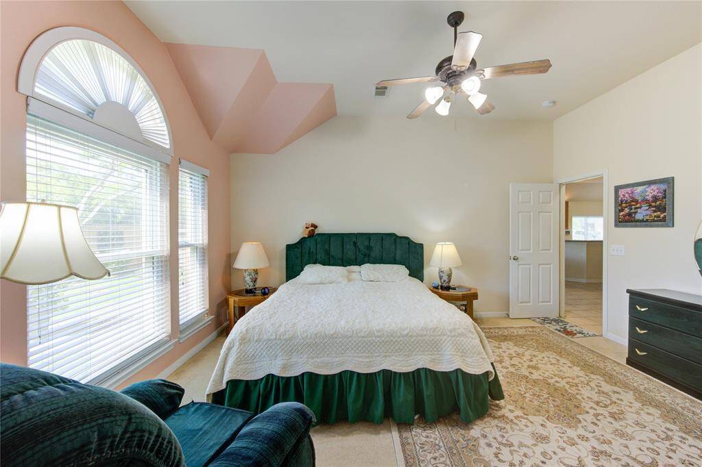 Retreat to the generously sized primary suite, offering a serene atmosphere and a well-appointed en suite bath designed for relaxation.