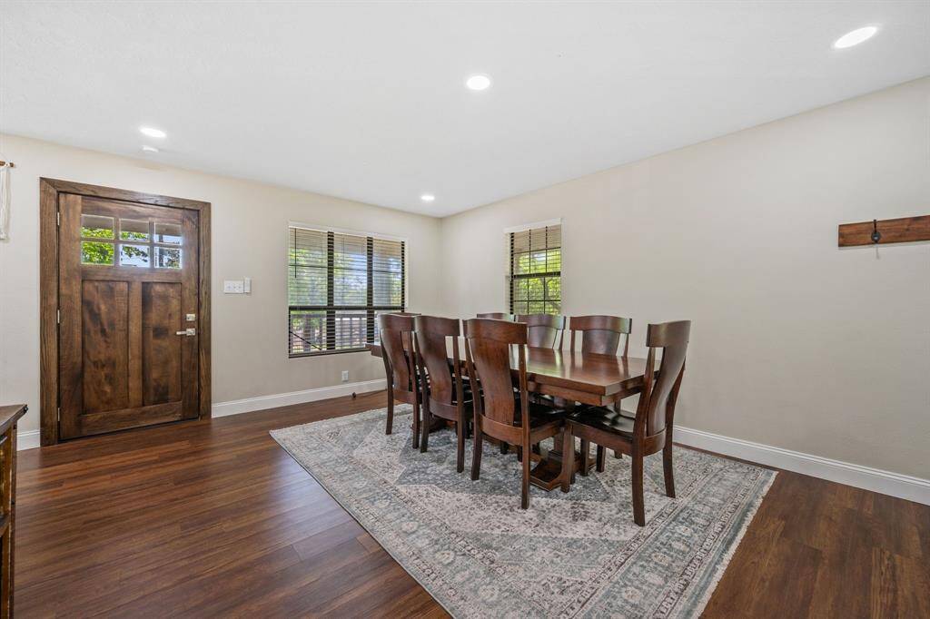 Just behind the breakfast bar is the large dining area with plenty of space for family gatherings. Take note of the wonderful lighting throughout this house. Great for capturing pictures during family events.