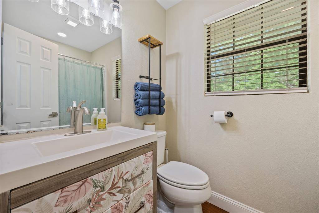 Just at the top the stairs, there is a full bathroom