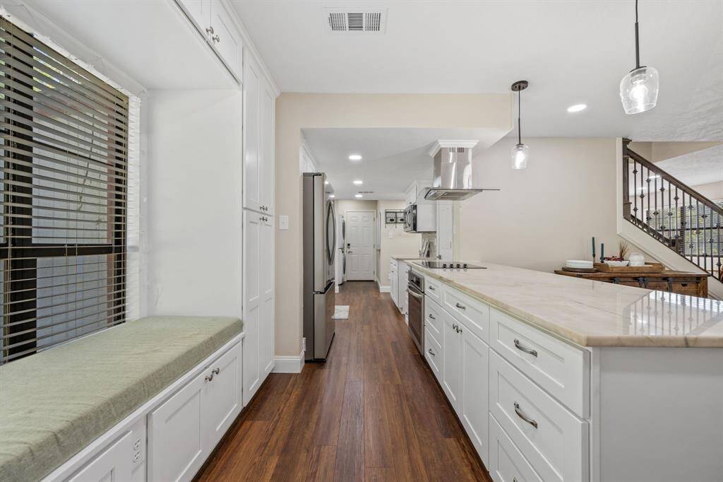 From this inside angle of the breakfast bar/kitchen area, you can really see the great storage throughout.