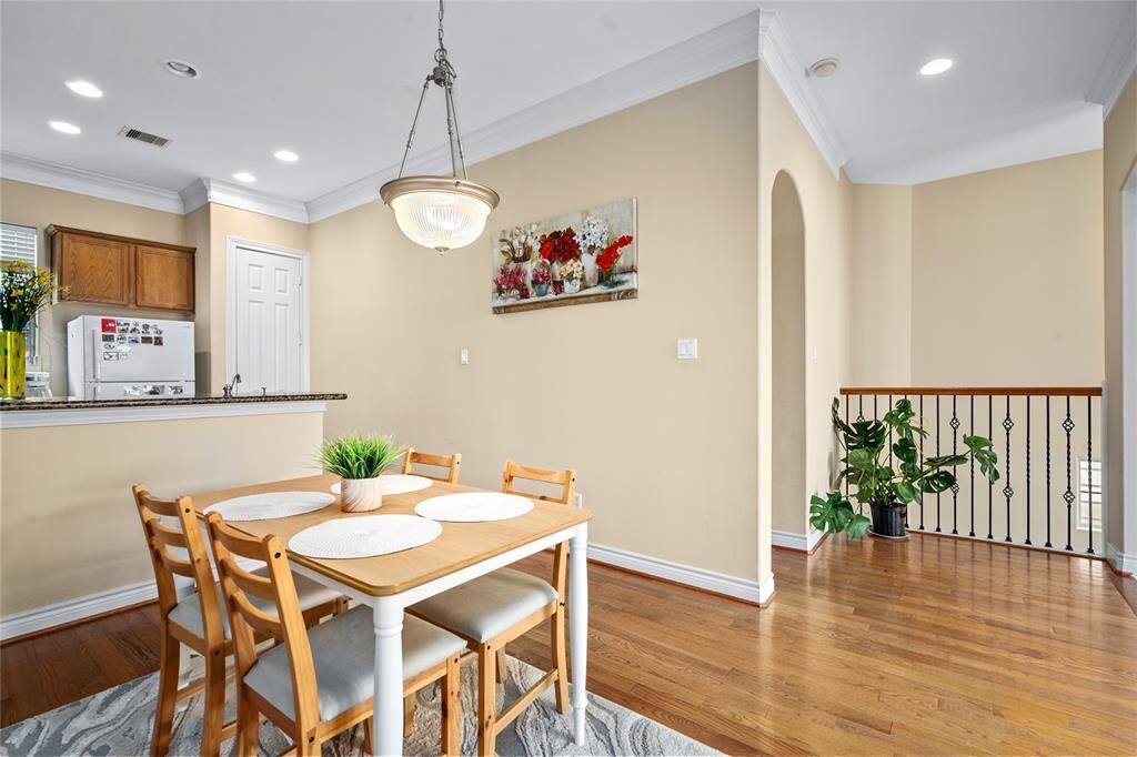 Tucked conveniently between the kitchen and living room, the dining area provides ample room for a full-size table and is perfectly positioned for easy serving and gathering.