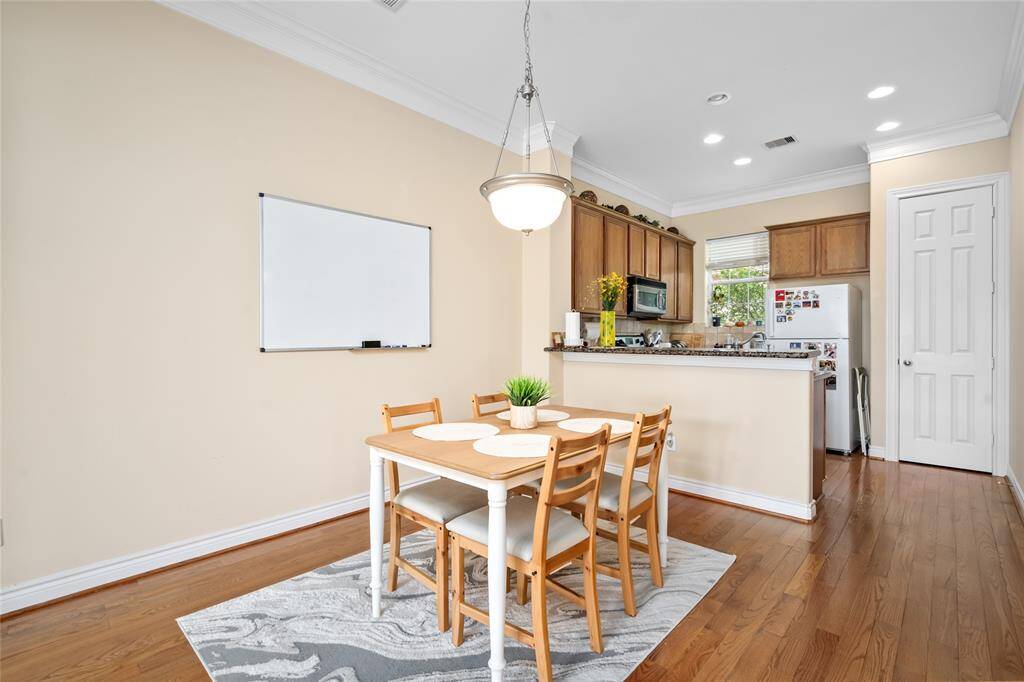 trategically located between the kitchen and living room, the dining area boasts plenty of room for a full-size table, making it ideal for both everyday meals and special gatherings.