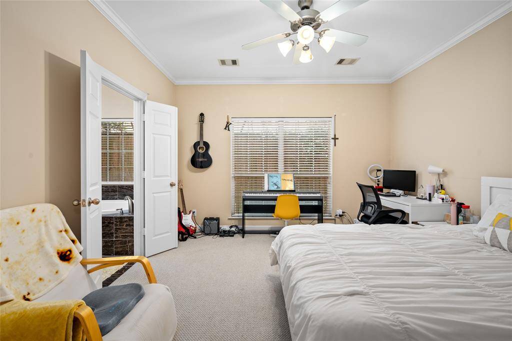 Relaxing and serene, the primary suite provides a generous layout filled with soft, natural light. It easily accommodates a king-sized bed and additional furnishings, with convenient access to the en-suite bathroom for added privacy and comfort.