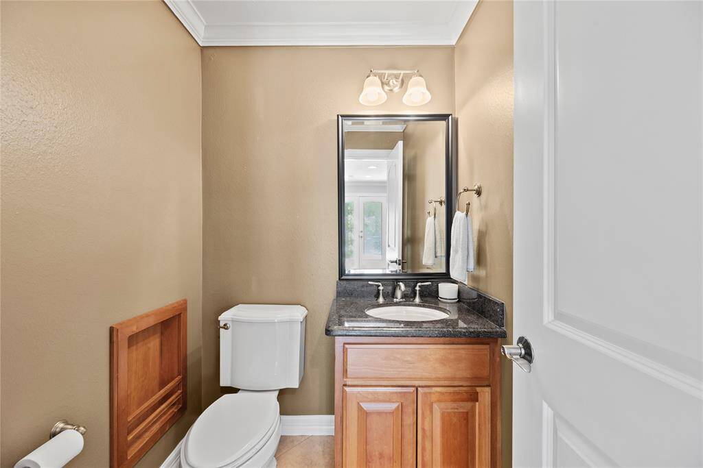 Hospitality is felt throughout the home and the powder room is no exception